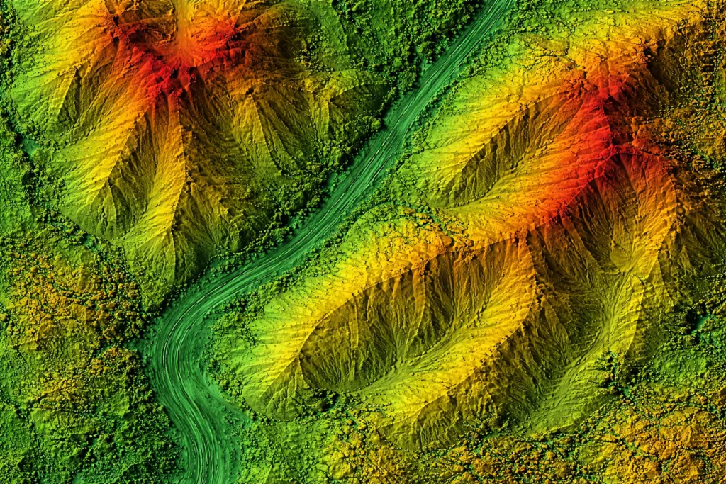 Abstract topography with mountainous structures in red, green, and yellow coloring.
